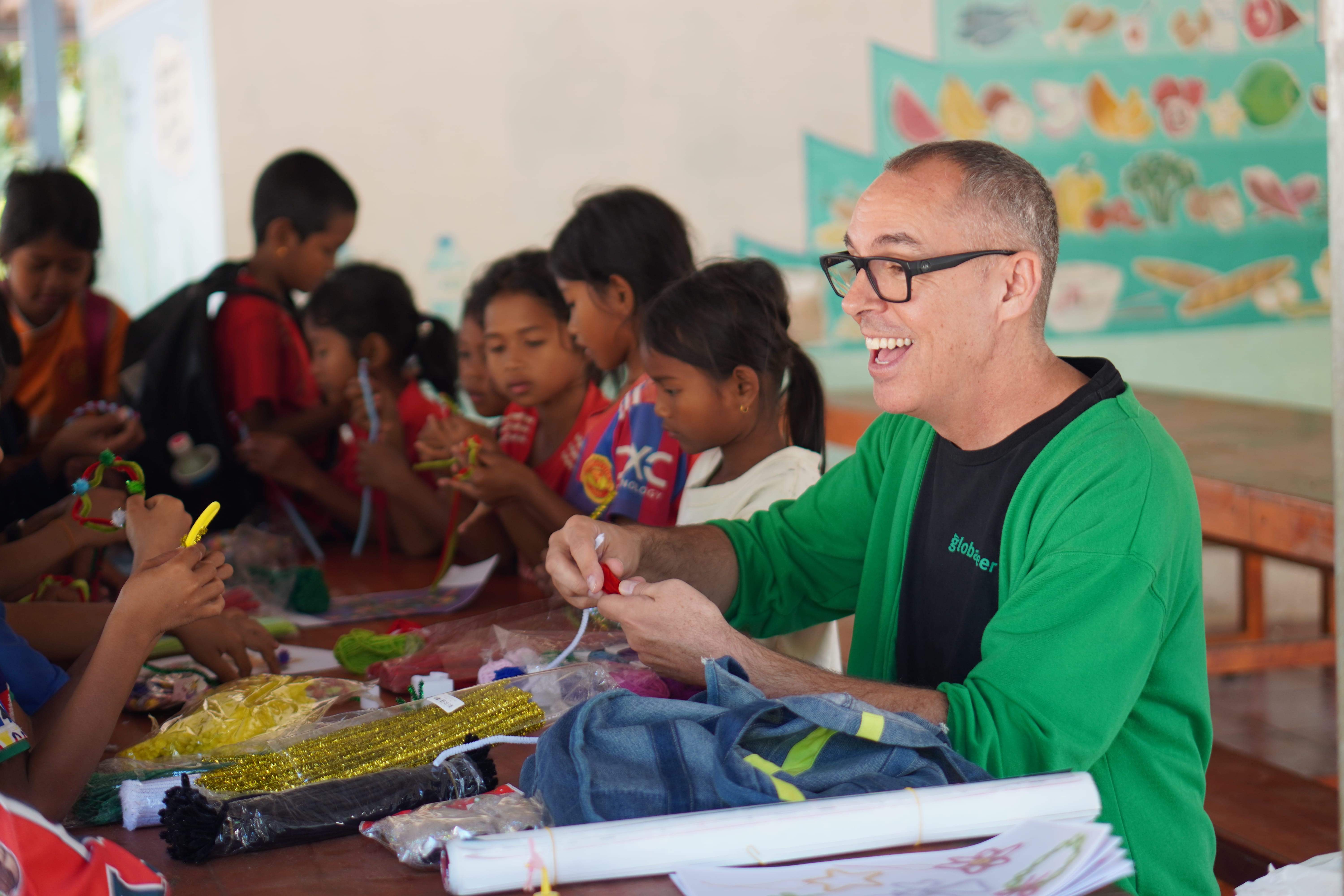Volunteer supporting classes at the NGO school