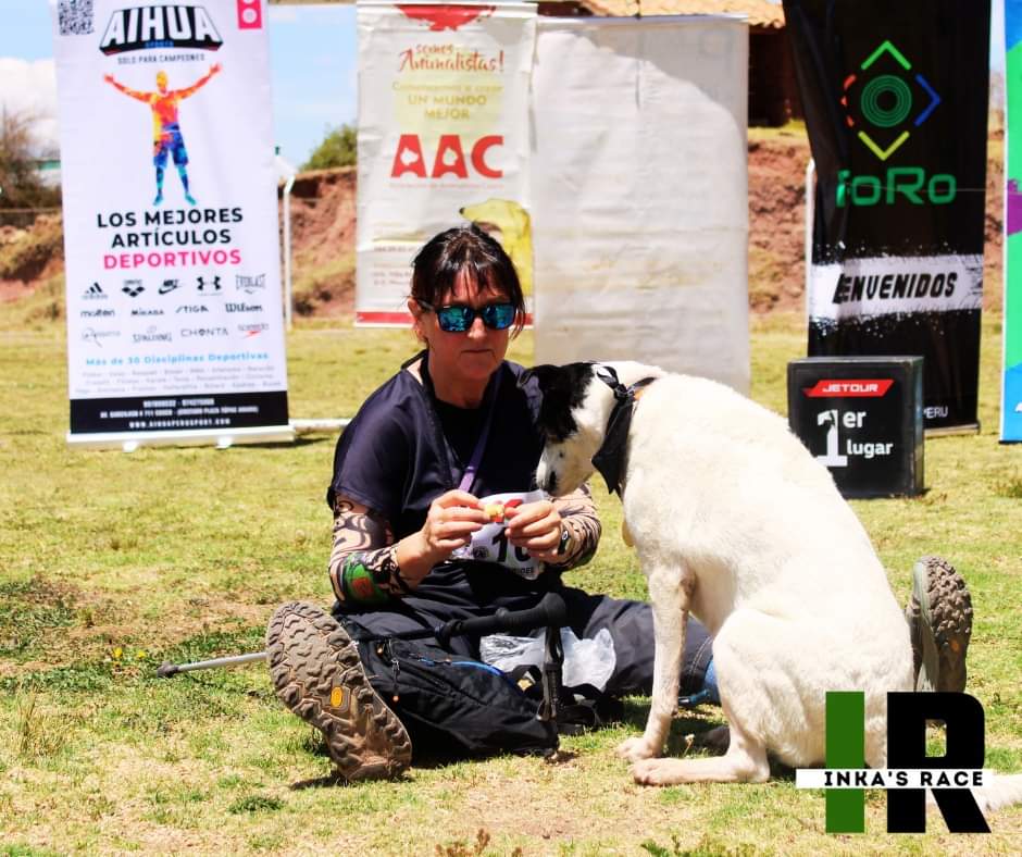 Runner with dog after the race Runner with dog after the race"