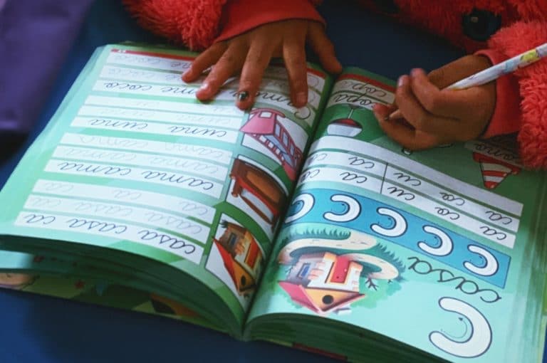 A child working in an exercise book