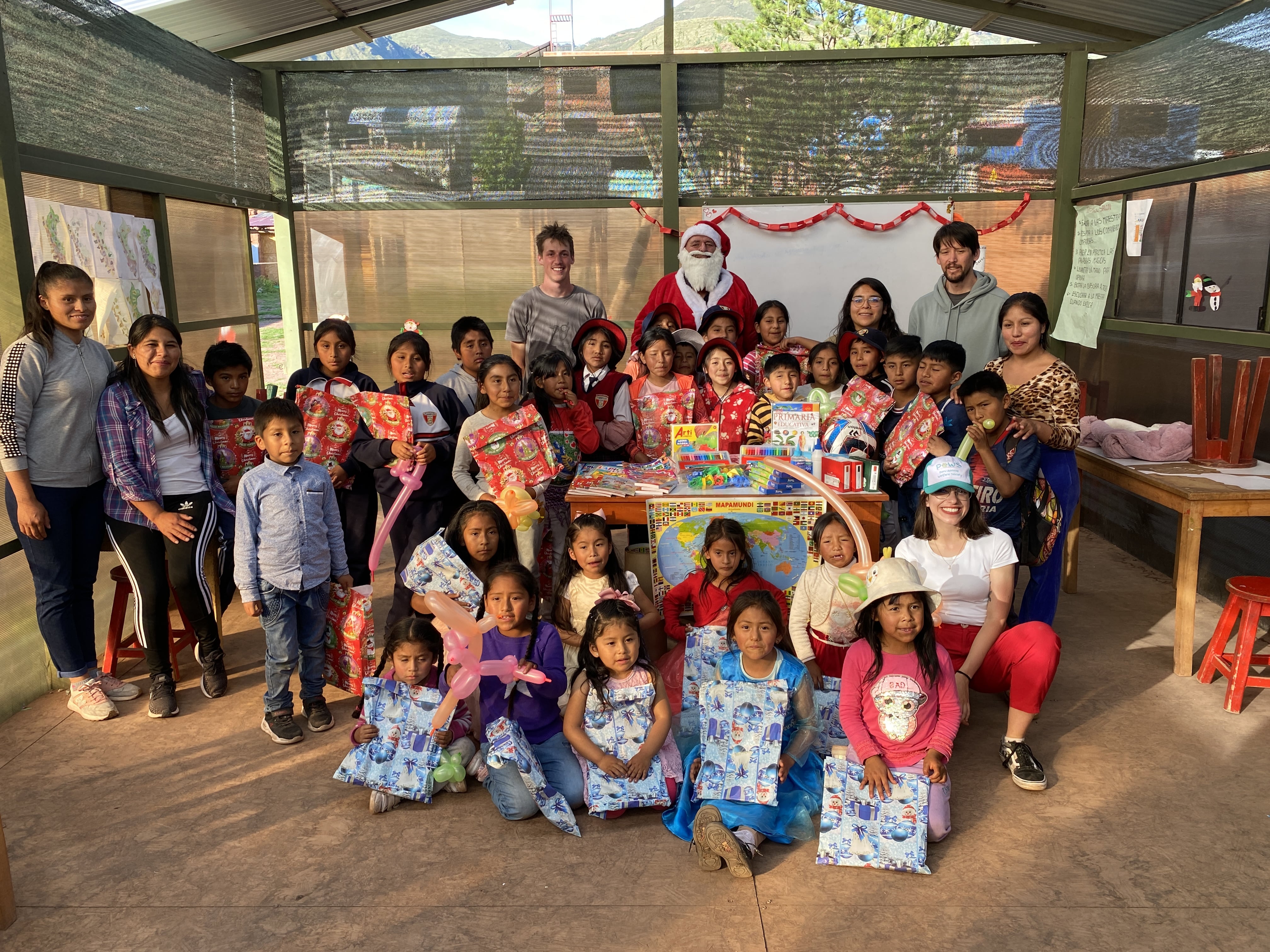 Younger students and staff with Santa Claus Younger students and staff with Santa Claus