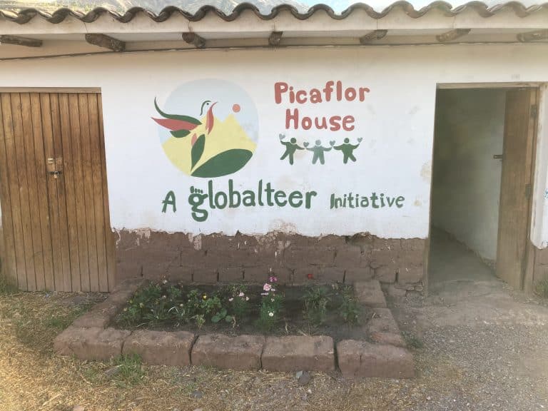 The Picaflor House sign on the school wall