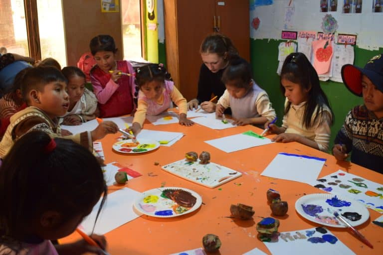 A teacher leading an art class