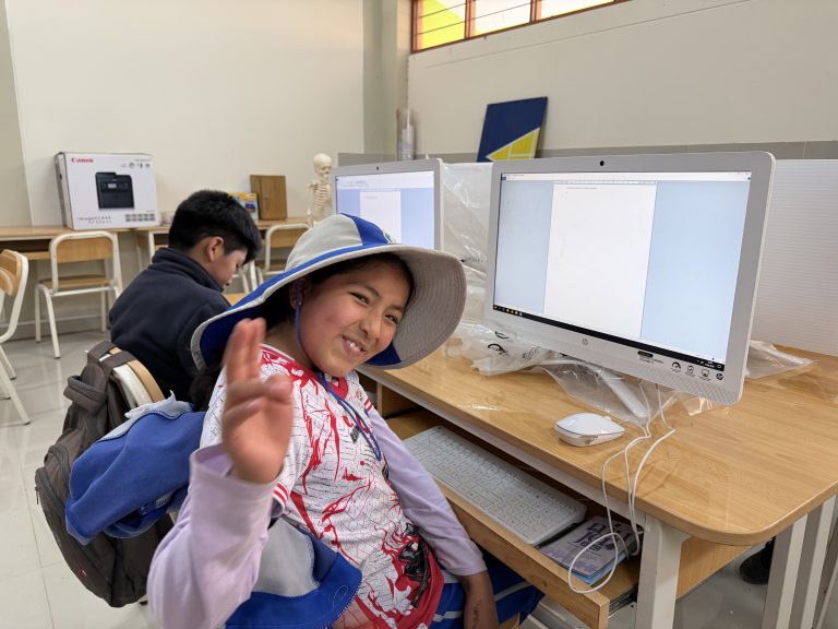 A girl smiling in the new computer room