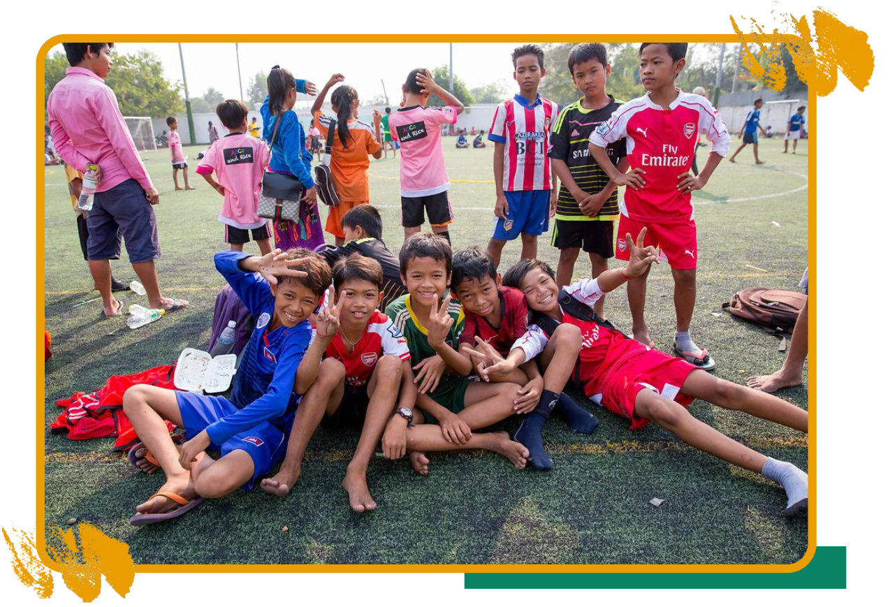 Young football players celebrating together after a match in Cambodia Young football players celebrating together after a match in Cambodia