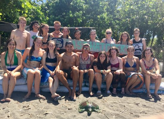 Volunteers with sea turtle in Costa Rica"