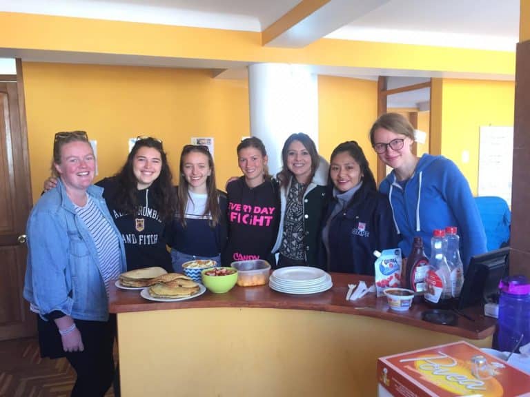 Volunteers cooking together in Cusco