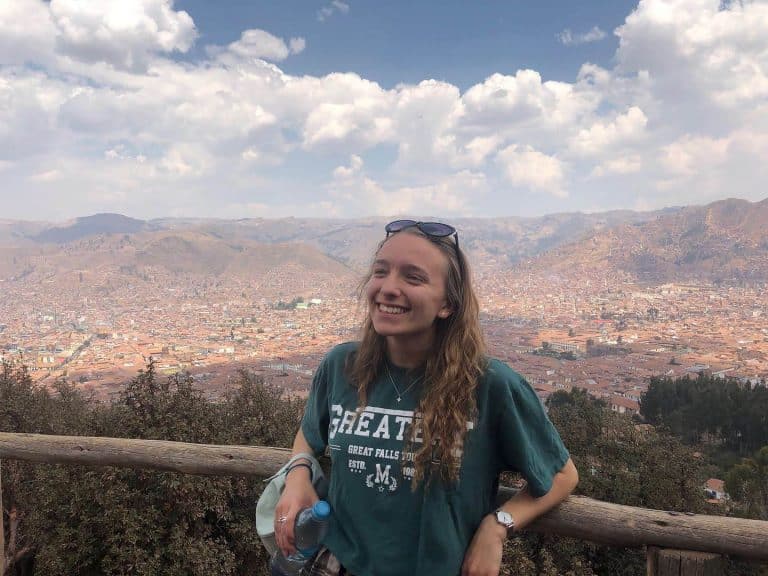 Volunteer at a viewpoint over Cusco