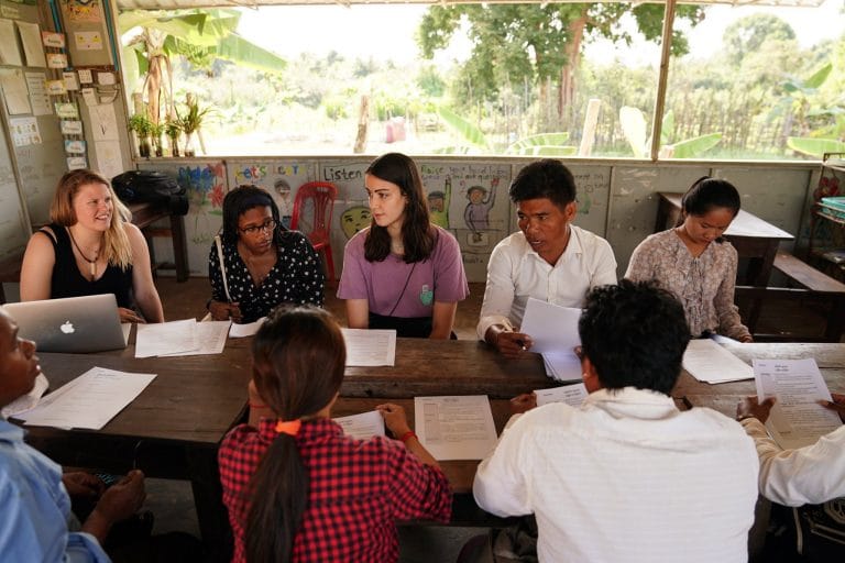Globalteer intern at a child protection meeting with local staff in Cambodia