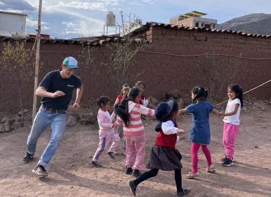 Florian with children at Picaflor House"