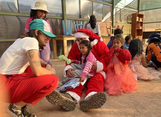 Larissa with children at Picaflor House"