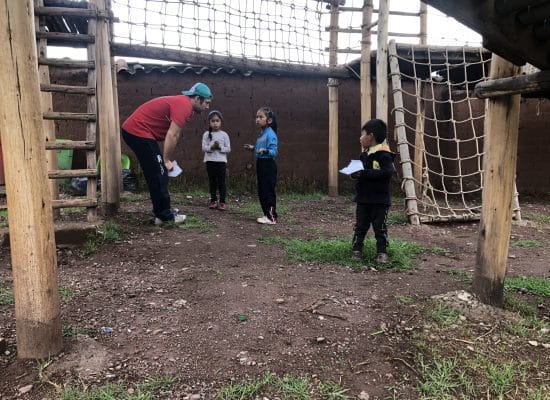 Louis with the children at Picaflor House"
