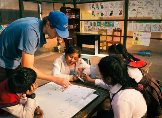 Helping children in class"