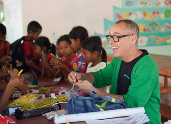 Volunteer with children in Cambodia