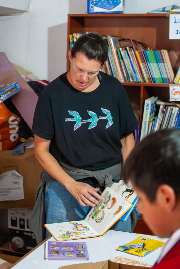 Volunteer sorting storybooks for the mobile library