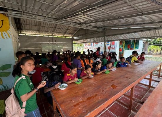 Students eating breakfast together at Helping Hands in rural Cambodia"