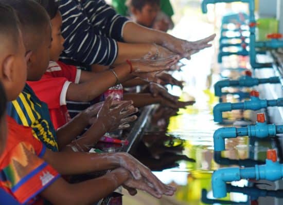 Children practising handwashing at a hygiene session in Cambodia"