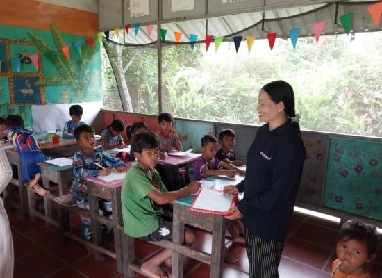 Social worker Kong with students at Helping Hands, Cambodia"